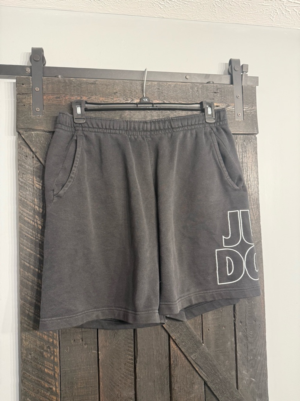 Nike Black Athletic Shorts with White Graphic